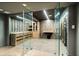 Stunning walk-in wine cellar featuring glass doors, custom shelving, and climate control at 265 Tara Trl, Atlanta, GA 30327