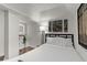 Bright bedroom features a sleek mirror, modern lighting, and inviting decor at 3143 Church St, East Point, GA 30344