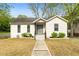 Charming one-story home with a well-manicured lawn and inviting entryway at 3143 Church St, East Point, GA 30344