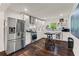 Modern kitchen featuring stainless steel appliances and a breakfast bar at 3143 Church St, East Point, GA 30344