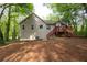 Back of the house with siding, green trees, and a deck at 69 Due West Pass, Dallas, GA 30157