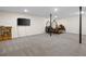 The basement offers a lot of open space with neutral carpet and potential for various uses at 69 Due West Pass, Dallas, GA 30157