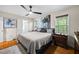 Bedroom with hardwood flooring, neutral walls, a ceiling fan, and plenty of natural light at 69 Due West Pass, Dallas, GA 30157