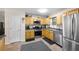Well-maintained kitchen with stainless steel appliances and tile flooring at 69 Due West Pass, Dallas, GA 30157