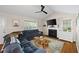 Cozy living room featuring a fireplace, plush seating, and ample natural light at 69 Due West Pass, Dallas, GA 30157
