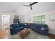 Open-concept living room with hardwood floors, plush seating, and plenty of natural light at 69 Due West Pass, Dallas, GA 30157