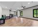 Finished basement featuring wood look flooring, bar and unique seating at 8275 Majors Ridge Way, Cumming, GA 30041