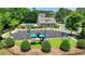 Aerial view of community playground, pool, clubhouse, and parking at 8275 Majors Ridge Way, Cumming, GA 30041