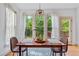 Cozy dining area with large windows providing ample natural light and backyard views at 8275 Majors Ridge Way, Cumming, GA 30041