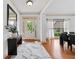 Bright foyer with white trim, a modern console table, and hardwood floors at 8275 Majors Ridge Way, Cumming, GA 30041