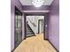 Hallway featuring a stairway with carpet runner, and access to rooms with hardwood floors at 8275 Majors Ridge Way, Cumming, GA 30041