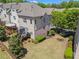 Aerial view of the backyard, featuring a deck, lush lawn, and mature trees at 1005 Glen Ivy, Marietta, GA 30062