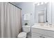 Bathroom featuring a shower with a curtain, toilet, and vanity with sink at 1005 Glen Ivy, Marietta, GA 30062