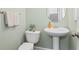 Stylish half bathroom featuring a pedestal sink and modern fixtures, perfect for guests at 1005 Glen Ivy, Marietta, GA 30062