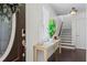 Bright foyer with hardwood floors, a console table, and stairs leading to the upper level at 1005 Glen Ivy, Marietta, GA 30062