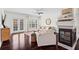 Bright living room with hardwood floors, a sofa, and an exit to an outdoor deck or patio at 1005 Glen Ivy, Marietta, GA 30062