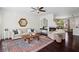 Inviting living room with a fireplace, dark hardwood floors, a ceiling fan, and modern decor at 1005 Glen Ivy, Marietta, GA 30062