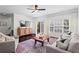 Bright living room with hardwood floors, a sofa, and an exit to an outdoor deck or patio at 1005 Glen Ivy, Marietta, GA 30062