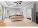 Large main bedroom featuring tray ceilings, ample natural light, and plush carpeting at 1005 Glen Ivy, Marietta, GA 30062