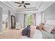 Spacious main bedroom with tray ceilings, a sitting area, and ensuite bathroom access at 1005 Glen Ivy, Marietta, GA 30062