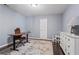 Office with dark wood floors, light blue walls, a white bureau, and a small desk with chair at 1005 Glen Ivy, Marietta, GA 30062