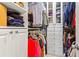 Organized walk-in closet with custom shelving, hanging rods, and ample storage space at 1005 Glen Ivy, Marietta, GA 30062