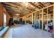 Unfinished basement with exposed beams and framing, offering potential for customization and expansion at 2649 Ogden Trl, Buford, GA 30519