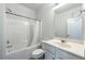 Clean bathroom features a shower-tub combination, white vanity, and a bright, airy feel at 2649 Ogden Trl, Buford, GA 30519
