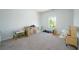 Bright bedroom with neutral carpet, a large window and room to play at 2649 Ogden Trl, Buford, GA 30519