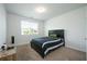 Simple bedroom featuring carpeted floors, a large window, and comfortable furnishings at 2649 Ogden Trl, Buford, GA 30519