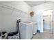 Laundry room with washer, dryer, and overhead storage at 2649 Ogden Trl, Buford, GA 30519