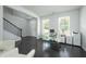 Bright home office features hardwood floors, natural light, and staircase at 2649 Ogden Trl, Buford, GA 30519