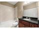 Bathroom with dark wood vanity, tile backsplash, tub/shower combination, and toilet at 2865 Lenox Ne Rd # 504, Atlanta, GA 30324