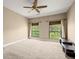 Spacious bedroom with a ceiling fan and two windows providing natural light at 2865 Lenox Ne Rd # 504, Atlanta, GA 30324