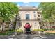Beautiful view of the building's facade, featuring multiple balconies, a canopy, and manicured landscaping at 2865 Lenox Ne Rd # 504, Atlanta, GA 30324