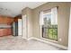 Dining area with tiled floors, a window overlooking greenery, and access to kitchen at 2865 Lenox Ne Rd # 504, Atlanta, GA 30324