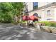 Lovely entrance to the building showcasing a red awning and professional landscaping at 2865 Lenox Ne Rd # 504, Atlanta, GA 30324