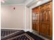 Hallway leading to a unit door with ornate carpeting and detailed trim at 2865 Lenox Ne Rd # 504, Atlanta, GA 30324