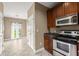 Well lit kitchen features stainless steel appliances, granite countertops, and wooden cabinetry at 2865 Lenox Ne Rd # 504, Atlanta, GA 30324