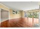 Open-concept living room with wood floors, balcony access, and ample natural light at 2865 Lenox Ne Rd # 504, Atlanta, GA 30324