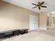 Open living room featuring neutral carpeting, base molding, ceiling fan and two closets at 2865 Lenox Ne Rd # 504, Atlanta, GA 30324