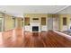 Bright living room features a fireplace, built-in cabinets, and gleaming hardwood floors at 2865 Lenox Ne Rd # 504, Atlanta, GA 30324