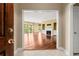 Spacious living room with hardwood floors, a fireplace, and a balcony with natural light at 2865 Lenox Ne Rd # 504, Atlanta, GA 30324