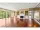 Bright living room features hardwood floors, large windows, fireplace, and a mirrored wall at 2865 Lenox Ne Rd # 504, Atlanta, GA 30324