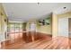 Light-filled living room featuring hardwood floors, a mirrored wall, and access to a balcony at 2865 Lenox Ne Rd # 504, Atlanta, GA 30324