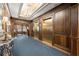 Elegant lobby featuring wood paneling, chandeliers, and elevator access at 2865 Lenox Ne Rd # 504, Atlanta, GA 30324