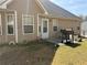 Backyard with a grill, patio, and space for outdoor seating and recreational activities at 4206 Shoreside Cir, Snellville, GA 30039