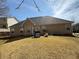 View of the backyard with grill and patio, perfect for outdoor entertaining at 4206 Shoreside Cir, Snellville, GA 30039