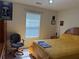 Well-lit bedroom features window, side table, chair, and space for personalization and relaxation at 4206 Shoreside Cir, Snellville, GA 30039