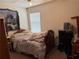 Comfortable bedroom with a window, soft lighting, and a cozy atmosphere with lots of storage at 4206 Shoreside Cir, Snellville, GA 30039